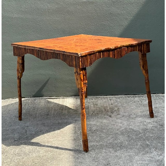 This vintage bamboo parquetry game table brings mid-century character to a room through its graphic tabletop and finely...