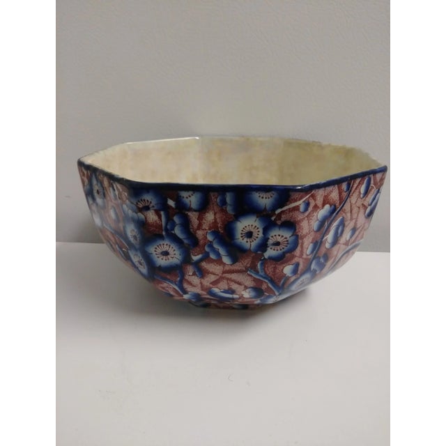 This 1950, 8-Sided Red and Blue Floral Bowl Made by Stoke-On-Trent England, has a lusterware inner finish. There are blue...