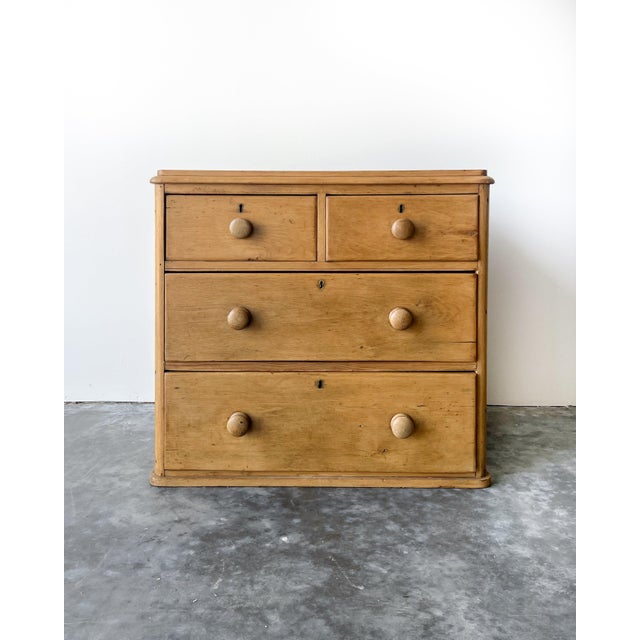 A charming antique English chest of drawers. A versatile two over there drawer formation, perfect as a bedside table, or...