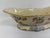 Decorative porcelain centerpiece bowl with scalloped form, hand-painted floral decoration, pale blue accents, and gilt...