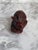 Japanese netsuke carved out of wood with a reddish stained finish. This chubby rabbit appears to be circa mid-20th century.
