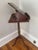 Mahogany bookstand on a turned pedestal base with a tripod base and Queen Anne style legs featuring a top that can be...