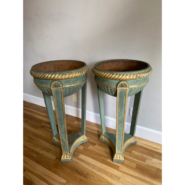Pair of Antique Painted Iron Athenian Planters raised on three legs supporting half moon basin