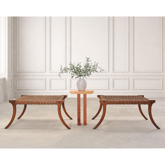 A sculptural pair of rare mid-century modern neoclassical klismos benches in the manner and style of T.H. Robsjohn-...