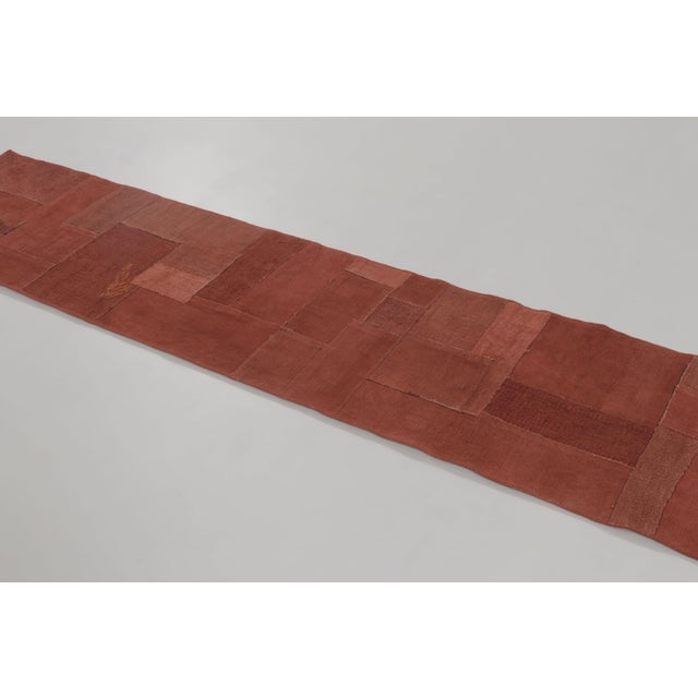 Handwoven in hemp and dating to circa 1950–1960, this vintage 2x9 Turkish kilim runner features a compelling patchwork...