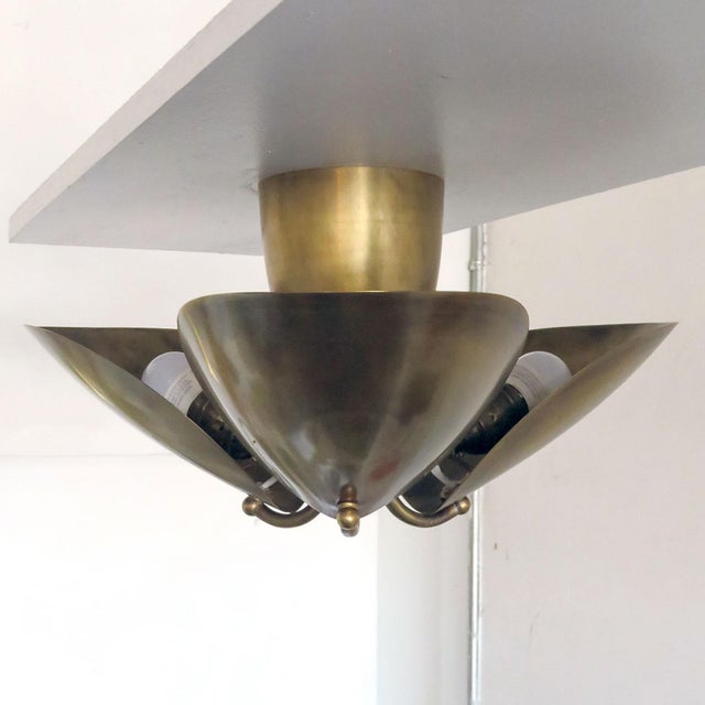 Wonderful, organic three-petal aged brass flush mount by Gallery L7, handcrafted and finished in Los Angeles from American...
