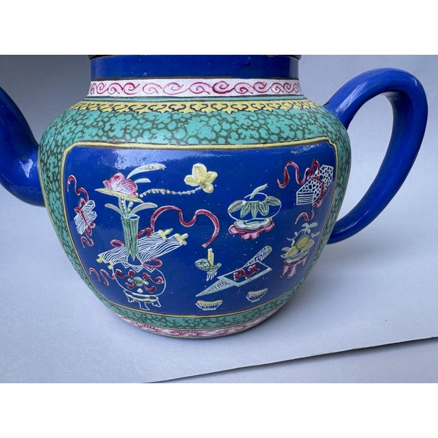 A gorgeous Chinese-style ceramic pot with an exceptionally detailed and distinctive design in beautiful turquoise and deep...