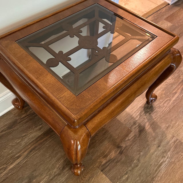 Add timeless elegance to your space with this vintage wood end table. Features a stunning fretwork design under a...