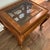 Add timeless elegance to your space with this vintage wood end table. Features a stunning fretwork design under a...