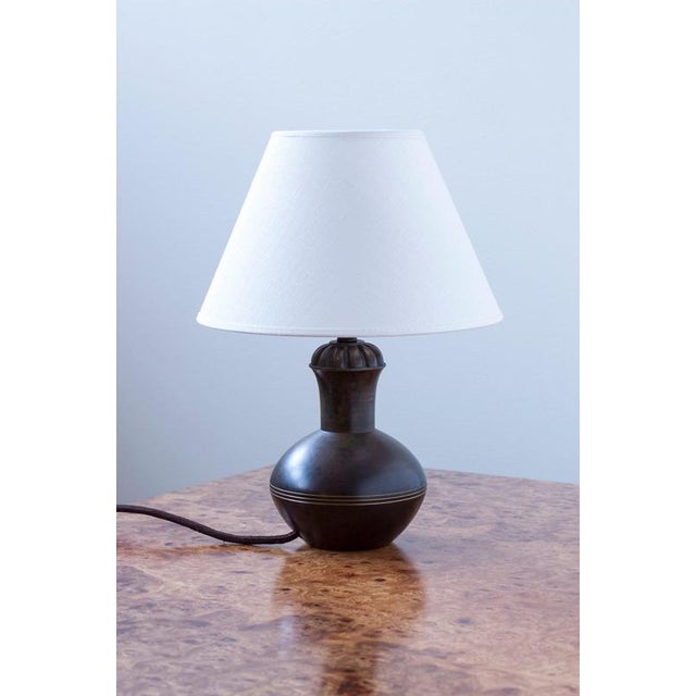 Bronze table lamp in the manner of Guldmesdaktiebolaget GAB. Produced in Sweden during the 1930s. Solid bronze with...