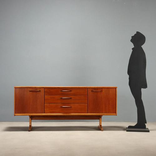 1960s English manufacture sideboard, crafted in wood with teak veneer. Recently restored in our workshops, it is in...
