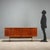 1960s English manufacture sideboard, crafted in wood with teak veneer. Recently restored in our workshops, it is in...
