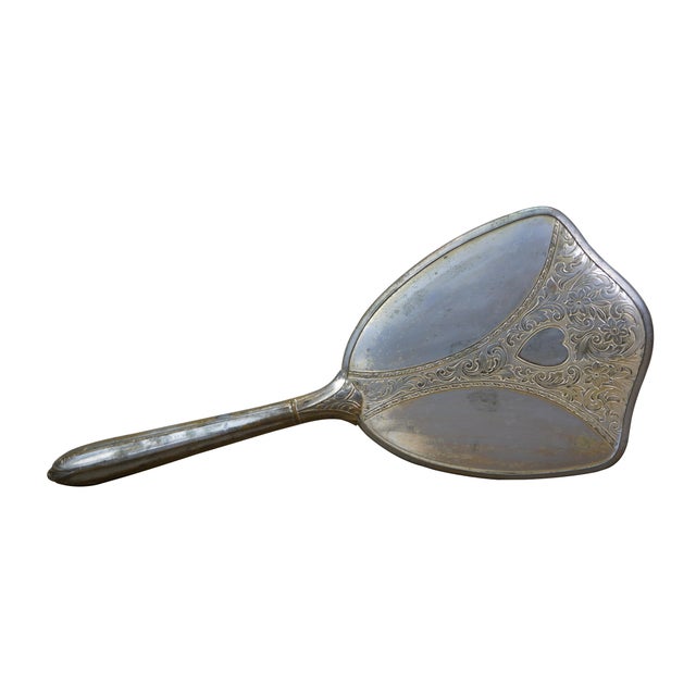 Antique Victorian Art Deco vanity hand mirror featuring a beveled mirror and etched floral / acanthus / heart accents...