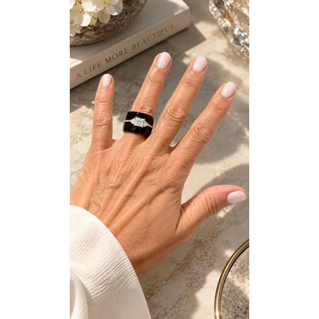 Graphic, bold, and unmistakably modern. This Italian ring is crafted in 18K rose gold and built around a deep black agate...