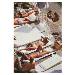 Slim Aarons, Sunbathers at Eden Roc, Estate Stamped Photographic Print, 1969 / 2020s For Sale