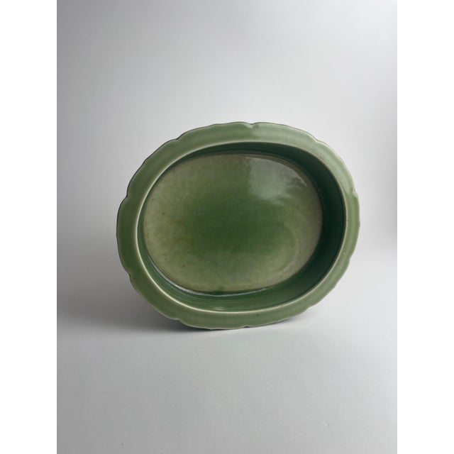 This celadon Rookwood dish, marked XLIV (44) for the year 1944 and model number 6817, is a graceful example of mid-20th-...