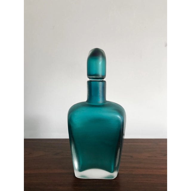 Incisi series bottle with stopper in submerged glass with fully ground surface, made by Venini Murano, engraved signature...