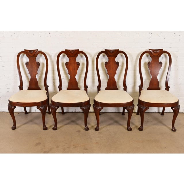 A gorgeous set of four Queen Anne or Georgian style dining chairs By Baker Furniture USA, Circa 1980s Solid carved...