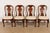 A gorgeous set of four Queen Anne or Georgian style dining chairs By Baker Furniture USA, Circa 1980s Solid carved...