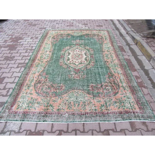 Hand-knotted Vintage rug from Oushak region of Turkey. Approximately 50-60 years old. In very good condition.