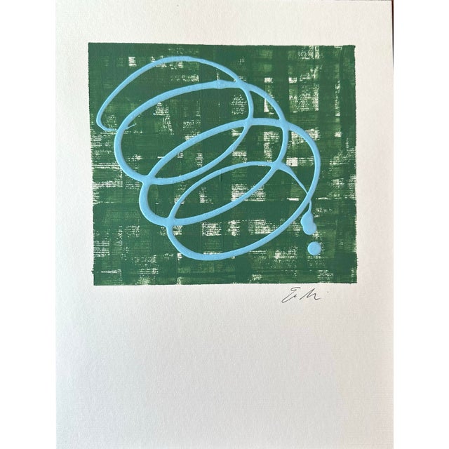Forest green background with a raised light blue “Imperfection” on paper signed on the front