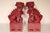 Pair of 36" tall maroon colored stoneware foo dogs, approximately 60 years old.