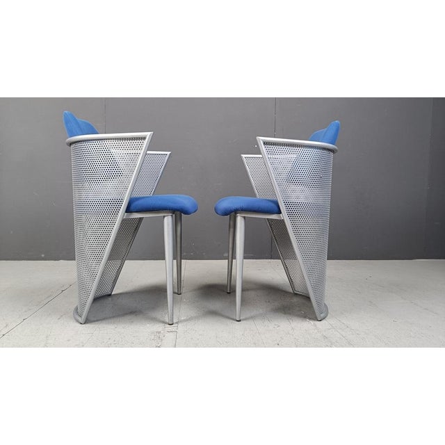 Set of 6 postmodern design armchairs/dining chairs made from a metal perforated frames and blue fabric seats and...