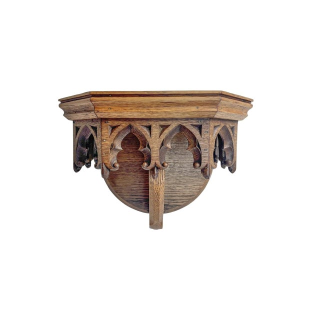 A Dutch oak wall bracket, carved with Neo-Gothic motifs. In good antique and original condition, with a crack in the wood...