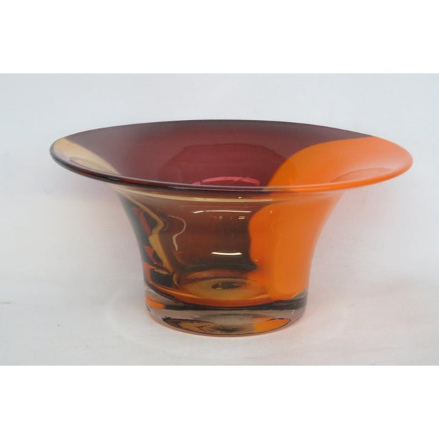 This lovely Centerpiece Bowl is made of blown glass. This bowl presents a gorgeous vintage style with a tri-color design...