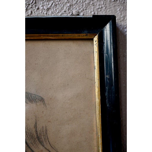The drawing is of good size. It is framed, under glass. Foxing is visible on the paper as well as gaps on the frame. The...