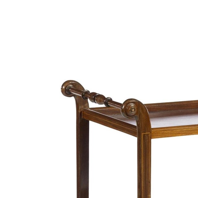 Furniture - Tea trolley. 20th-century Portuguese; made of mahogany wood with two trays. Feet with casters. Dimensions: 79...
