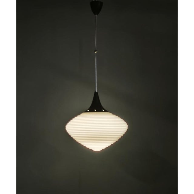 Exceptional pair of space age pendant lights produced in kamenický šenov, czechoslovakia, in the 1970s. Each pendant...