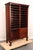 Antique music sheet cabinet made of dark stained mahogany with the original brass hardware. It features twenty-four...