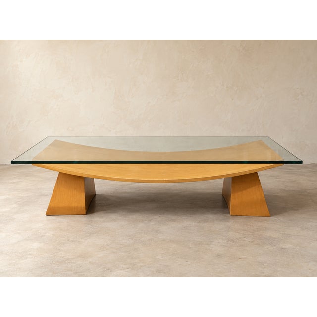 A striking vintage Italian coffee table with an architectural, almost floating silhouette. Measuring an impressive 68...
