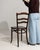 A dining chair whose dark ebonized wood, ladder back gives it real character at first glance. The piece dates to Early...
