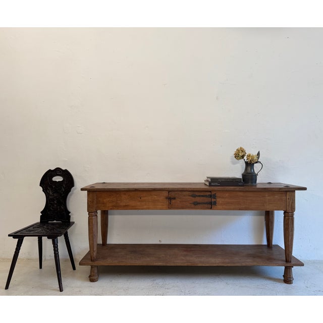 An exceptional Spanish console table or prep table made of solid teak with wrought-iron fittings. Crafted in the 20th...