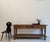 An exceptional Spanish console table or prep table made of solid teak with wrought-iron fittings. Crafted in the 20th...
