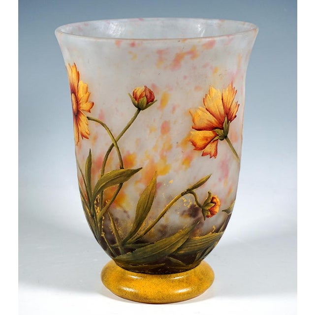 Chalice-shaped vase with a stepped ring-shaped foot, a curved wall opening upwards, colourless glass with milky white and...