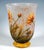 Chalice-shaped vase with a stepped ring-shaped foot, a curved wall opening upwards, colourless glass with milky white and...