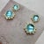 Created in 18 karat yellow gold Blue Topaz 21 carats approx. Diamonds 0.80 carat approx. Post back for pierced ears...