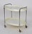 Very rare mid-century bar cart in white plastic and chromed metal. This piece is in very good condition, was designed in...