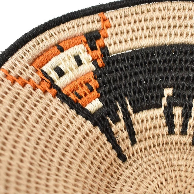 The Sisal Handwoven Basket from Eswatini is a beautifully crafted piece of traditional African artistry. Handmade by...