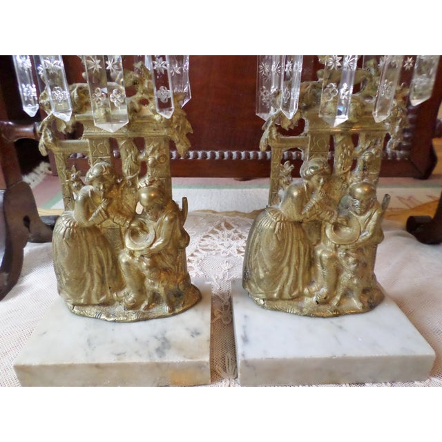 This is a Beautiful Pair of Antique French Brass and Marble Girandole Set /Candelabras with Crystal Prisms with a Woman...