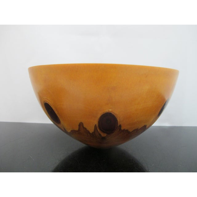 Stunning turned Norfolk Island Pine wood bowl, crafted by artist Jess Craig in Hawaii, featuring distinctive dark knots in...