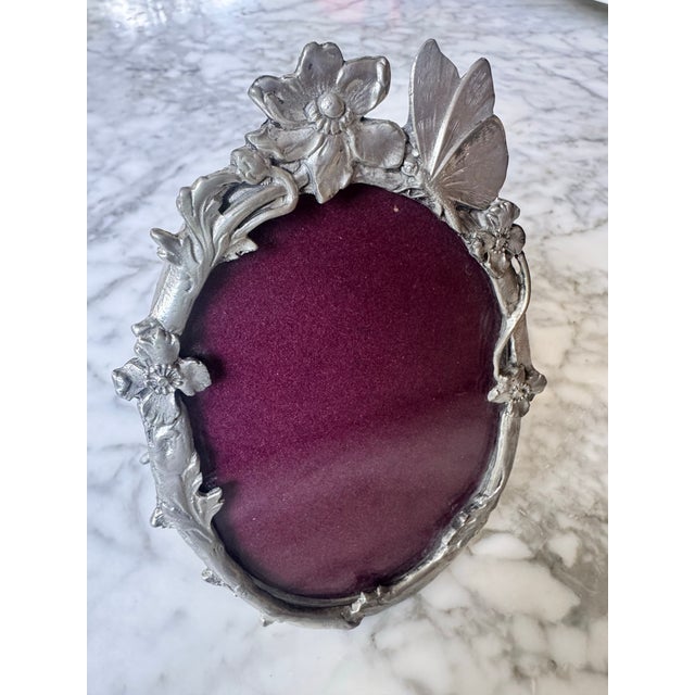 Elias Artmetal ornate oval picture frame with gorgeous handcrafted flower and butterfly motifs. Handcrafted in high-...