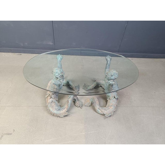 Fantastic Italian nautical cocktail table or coffee table featuring a pair of patinated bronze Putti Di Mare mermaids...