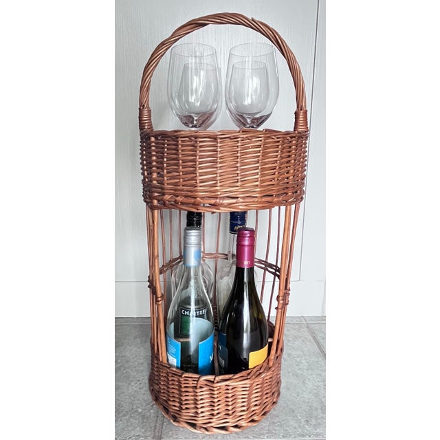 Vintage 1960s French Wicker Tall Bottle Basket or Wine Bar. This woven wicker handled basket caddy can hold bottles in the...