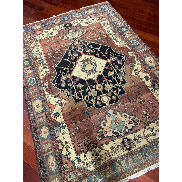 A rare antique Bahsais rug distinguished by its exceptional design, intricate drawing, and beautifully balanced...