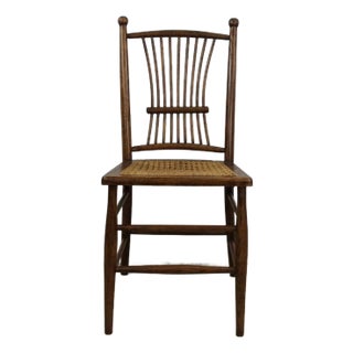 Antique Oak Chair With Unique Turned Wood Back and Caned Seat For Sale