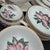 A beautiful vintage “Modern Orchid” china set by Paden City Pottery, featuring a stylized pink orchid bloom with lush...